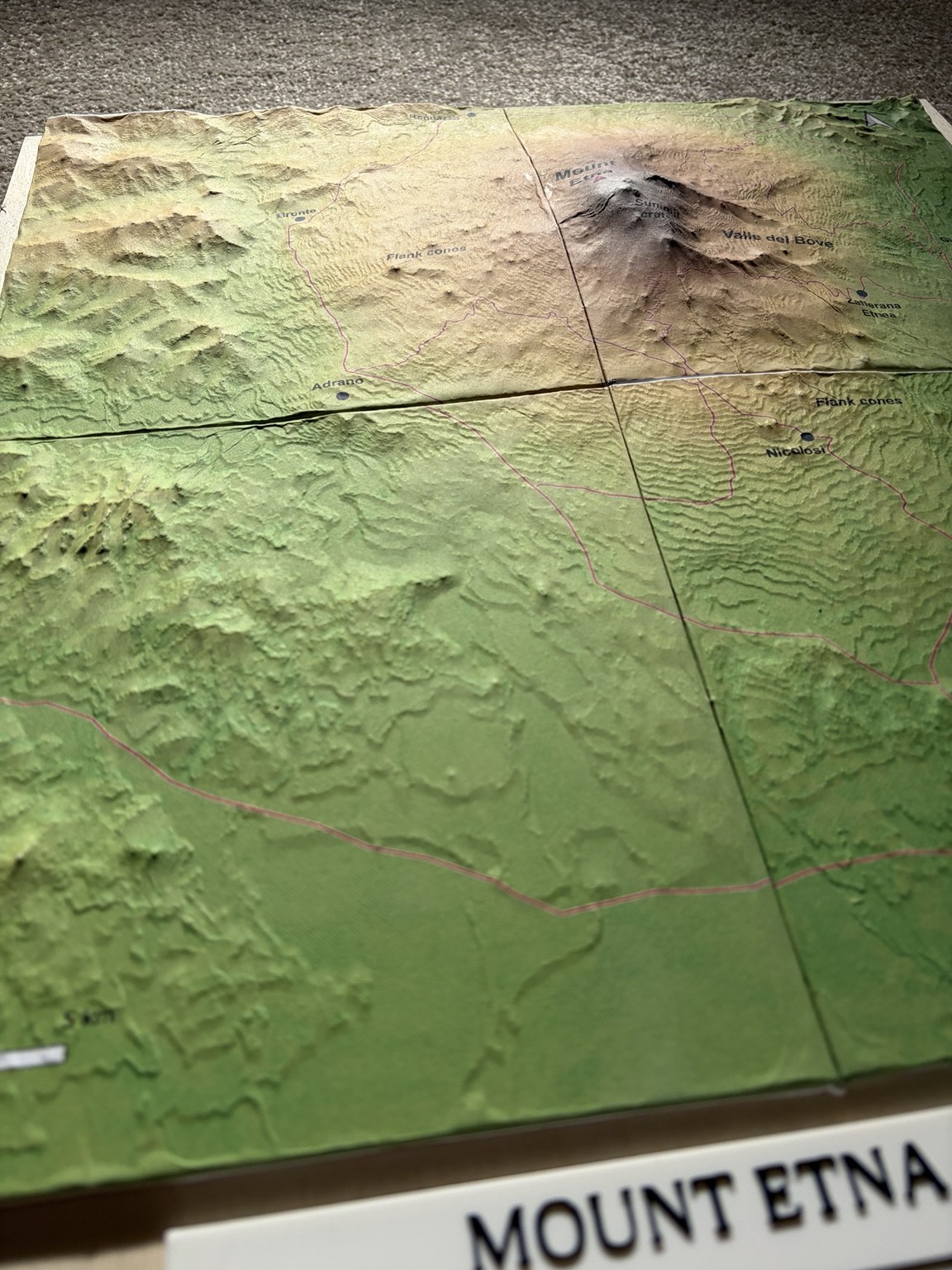 Angled view of the finished Mount Etna model, showing the paper map following the summit and surrounding slopes.