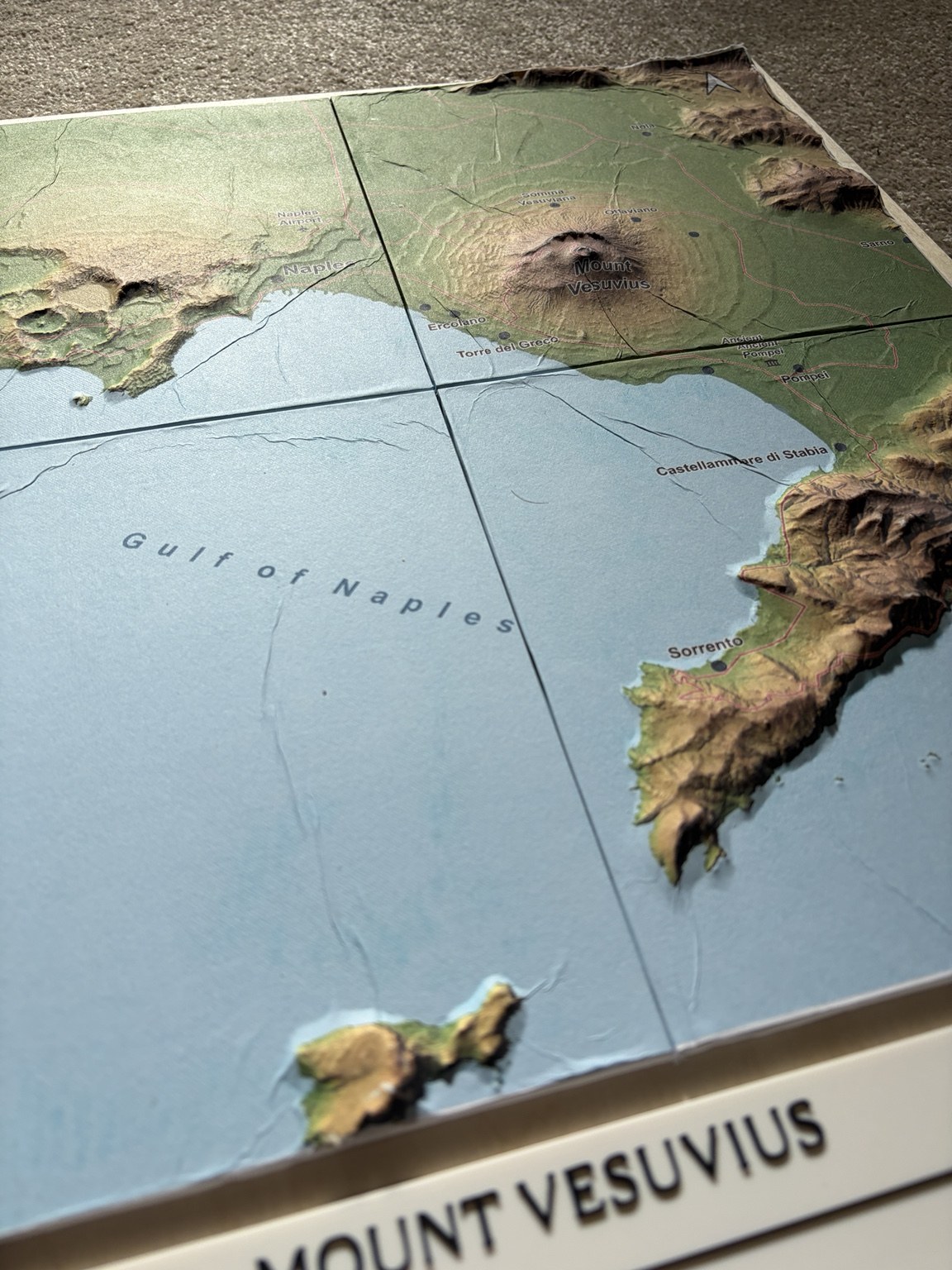 Oblique view of the Vesuvius paper-covered relief, including the mountain, coast and Bay of Naples.